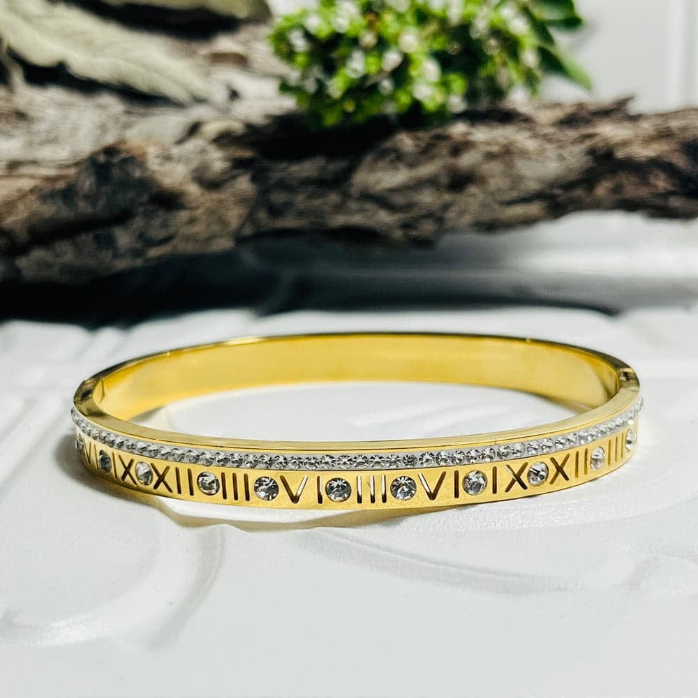 This Roman numeral bangle and ring set adds effortless glamour to your everyday style.